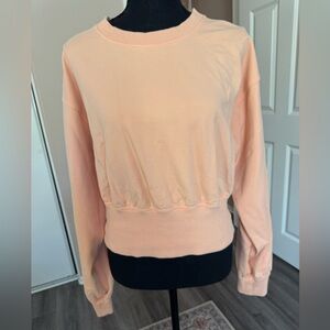 Lululemon peach pullover size 10.